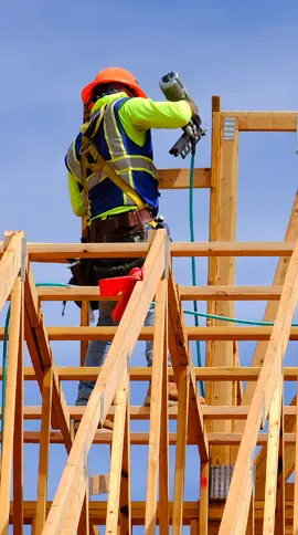 person doing construction on a roof