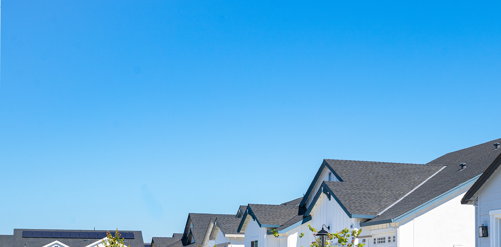 row of houses with blue sky